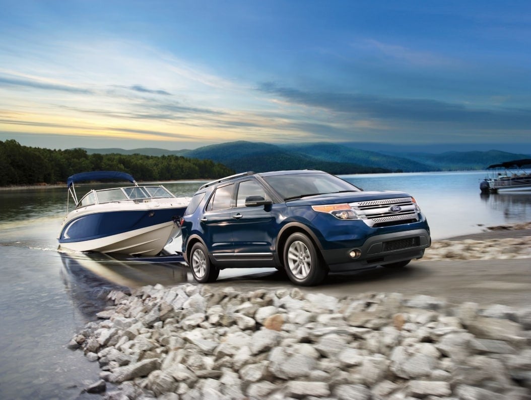 image of a Ford SUV towing a boat out of water